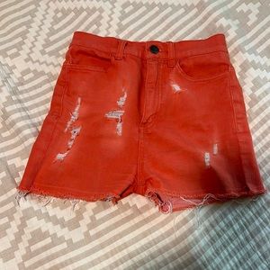 Stretchy orange high waisted shorts. S